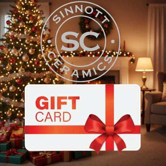 Gift card with red ribbon and bow, featuring Sinnott Ceramics logo.